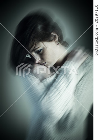 Composite image of sad pretty brunette thinking with arms crosse 20297110