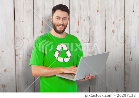 Composite image of portrait of man working on laptop in office 20297138
