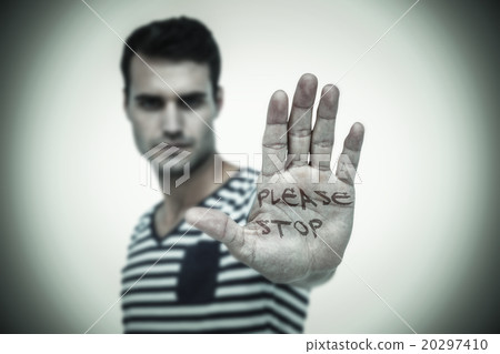Composite image of portrait of serious man making stop sign Composite image of portrait of serious man making stop sign 20297410