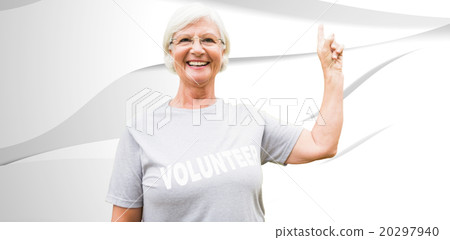 Composite image of happy volunteer grandmother with thumbs up 20297940