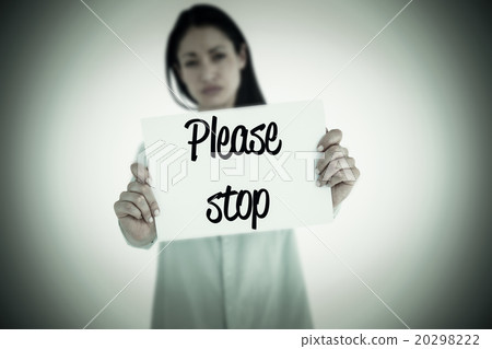 Composite image of sad woman showing sign Composite image of sad woman showing sign 20298222