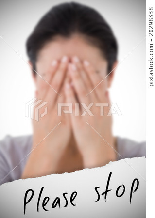 Composite image of sad woman hiding her face Composite image of sad woman hiding her face 20298338