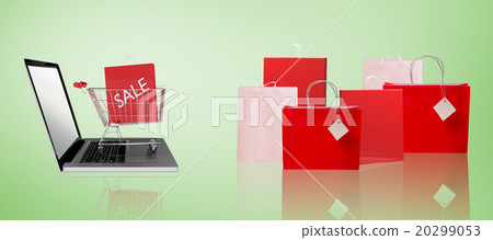 Composite image of trolley on laptop with sale bag Composite image of trolley on laptop with sale bag 20299053