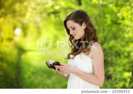 Beautiful woman with book 20300453