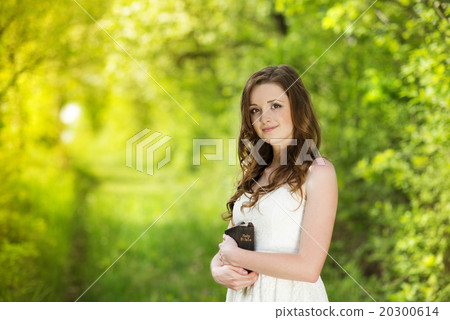 Beautiful woman with book 20300614