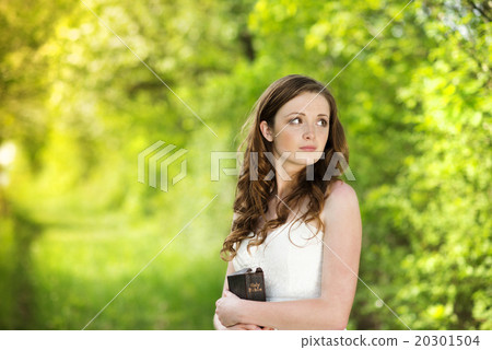 Beautiful woman with book 20301504