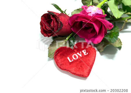 Heart shaped and red roses on white background. 20302208