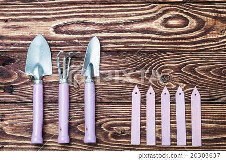 Gardening tools on old wooden background Gardening tools on old wooden background 20303637