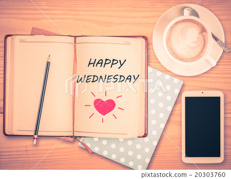 Happy Wednesday on notebook and coffee cup Happy Wednesday on notebook and coffee cup 20303760