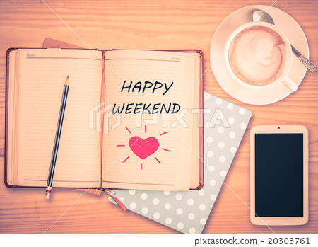 Happy Weekend on notebook and coffee cup  20303761