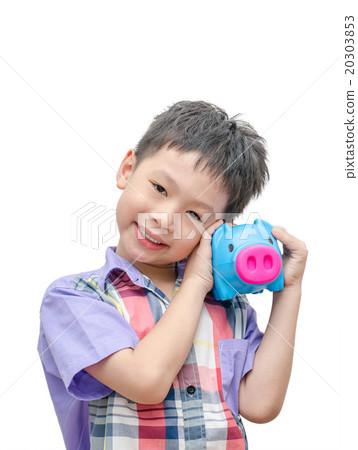smiling boy with piggy bank isolated on white smiling boy with piggy bank isolated on white 20303853
