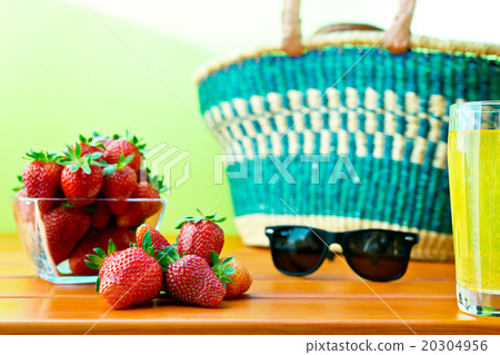 red ripe strawberry with shopping basket 20304956