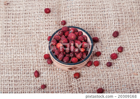 Citrus in a wicker basket on wooden background 20309168