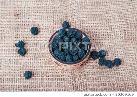 Citrus in a wicker basket on wooden background 20309169