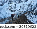 Trekkers walking on the ridge in Himalayas 20310622