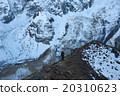 Trekkers walking on the ridge in Himalayas 20310623