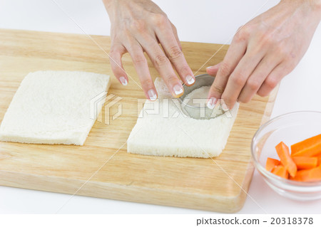 Bread cut into circle shape on white plate Bread cut into circle shape on white plate 20318378