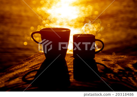 Silhouettes of morning coffee on the lake. 20318486