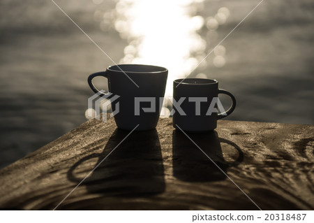 Silhouettes of morning coffee on the lake. Silhouettes of morning coffee on the lake. 20318487