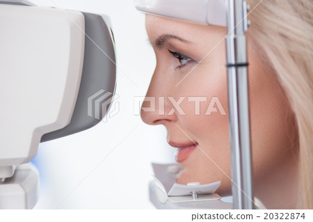 Pretty young woman is visiting eye doctor Pretty young woman is visiting eye doctor 20322874