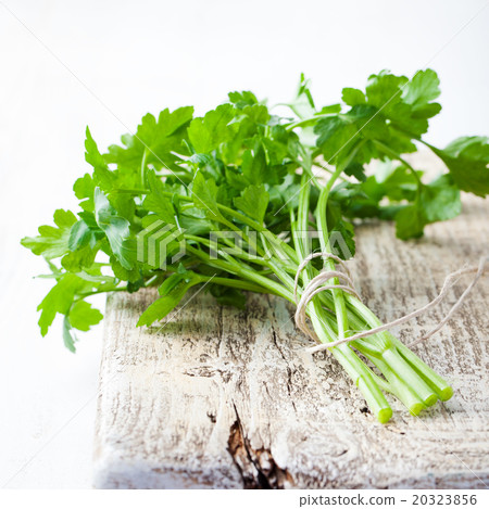 Organic fresh Parsley on grey wooden background Organic fresh Parsley on grey wooden background 20323856