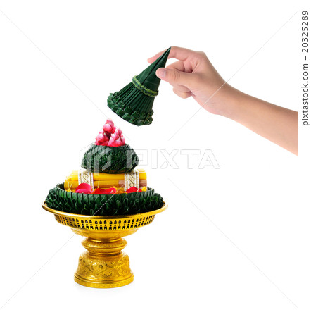 hand holding flower decorated on tray  20325289
