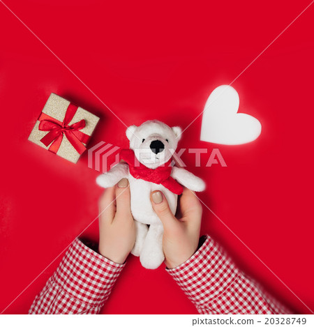 woman holding white bear on red woman holding white bear on red 20328749