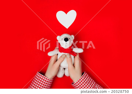 woman holding white bear on red woman holding white bear on red 20328750