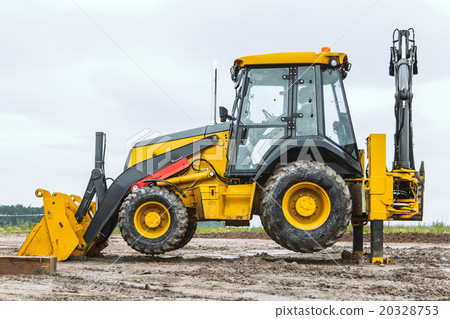 Yellow bulldozer overcome barrier Yellow bulldozer overcome barrier 20328753