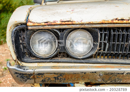 Old car covered with web 20328789