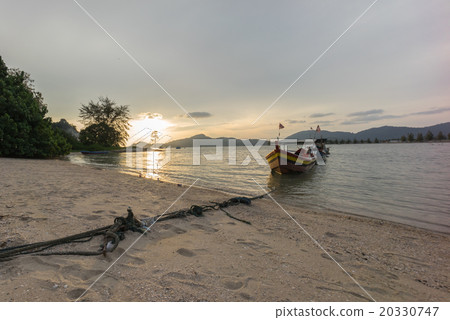Fisherman boat at the beach during sunset Fisherman boat at the beach during sunset 20330747