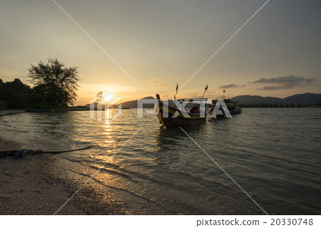 Fisherman boat at the beach during sunset Fisherman boat at the beach during sunset 20330748