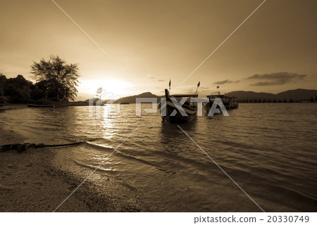 Fisherman boat at the beach during sunset Fisherman boat at the beach during sunset 20330749