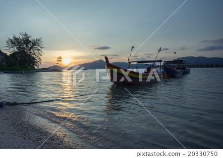 Fisherman boat at the beach during sunset Fisherman boat at the beach during sunset 20330750