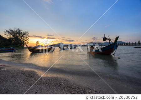 Fisherman boat at the beach during sunset Fisherman boat at the beach during sunset 20330752