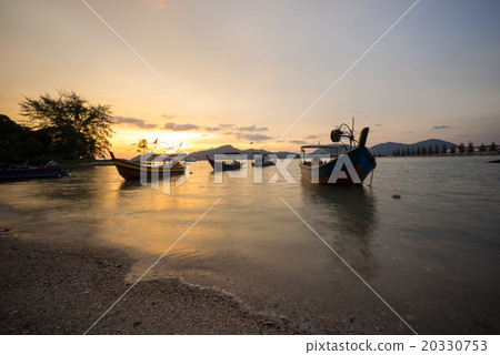 Fisherman boat at the beach during sunset 20330753