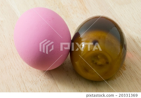 Two Pink Century Eggs on Wooden Board 20331369