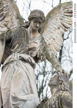 statue in a cemetery at fall statue in a cemetery at fall 20334449