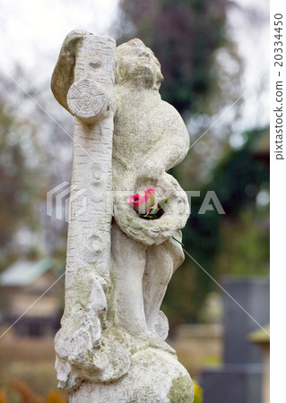 statue in a cemetery at fall statue in a cemetery at fall 20334450