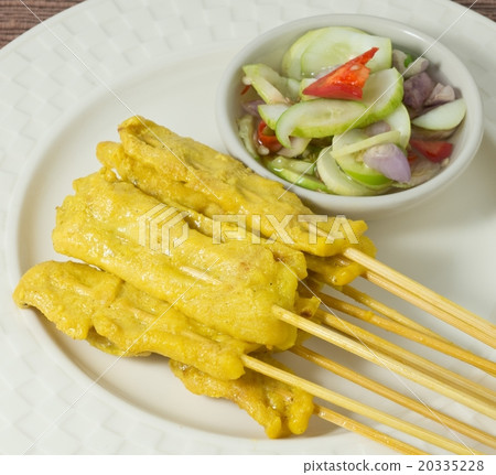 Grilled Pork Satay Served with Cucumber Salad Grilled Pork Satay Served with Cucumber Salad 20335228