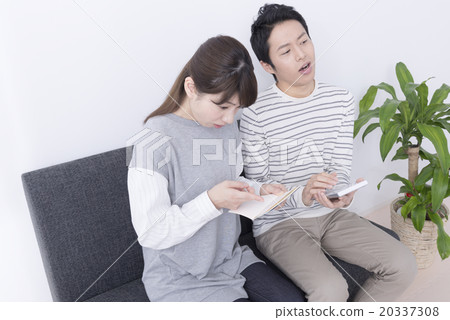 Couple confirming passbook 20337308