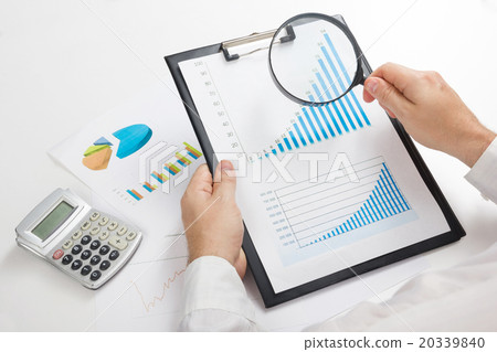 Businessman counting losses and profit working Businessman counting losses and profit working 20339840