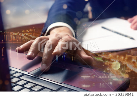Double expo. Businessman hands typing on a 20339841