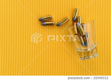 Bullets in drinking glass Bullets in drinking glass 20340312
