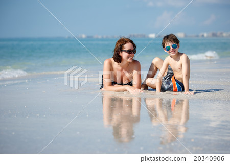 Mother and son on tropical beach in Florida 20340906
