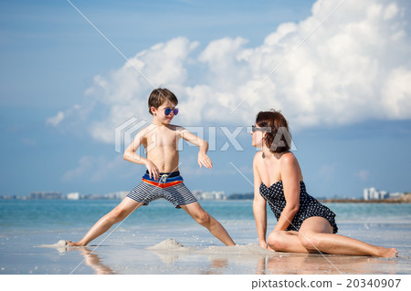Mother and son on tropical beach in Florida 20340907