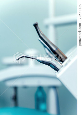 Different dental instruments and tools in a 20342420