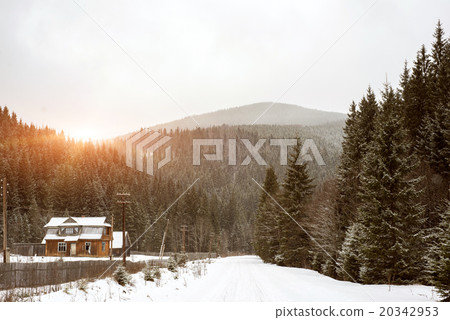 Cold day up in mountains with a road that people 20342953