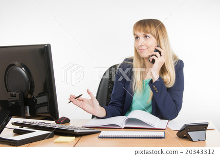 Business woman finds the right information on the phone Business woman finds the right information on the phone 20343312