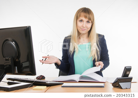 Indifferent office a specialist office leafing through a book Indifferent office a specialist office leafing through a book 20343315